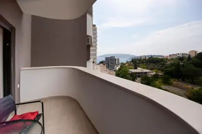 a balcony with a view of a city at Adriatic calm Terrace & Parking in Becici