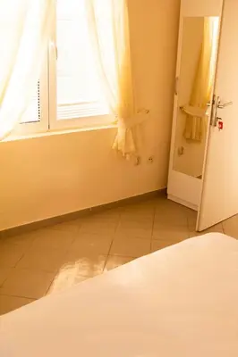 an empty room with a window and a door at Vila Kraljica Snežna in Kravlja