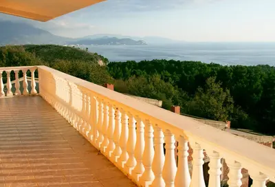 a balcony with a view of the ocean at Vila Kraljica Snežna in Kravlja