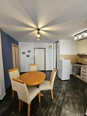 a kitchen and dining room with a table and chairs at Charming Central Flat - Balcony with Mountain View, Near Beach in Budva