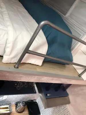 a metal rail on the bottom of a bunk bed at Lucky Space 1 Nice&Cosy Studio in Budva