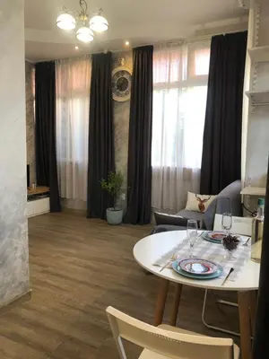 a living room with a table and chairs at Lucky Space 1 Nice&Cosy Studio in Budva