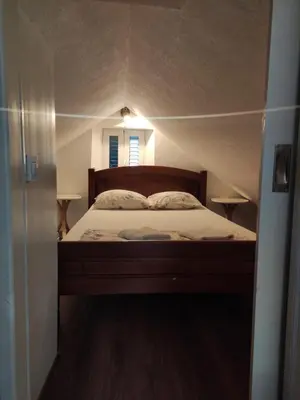 a bedroom with a bed in a small room at sar 6 in Kotor