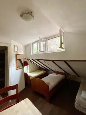 a room with two beds and a window at sar 6 in Kotor