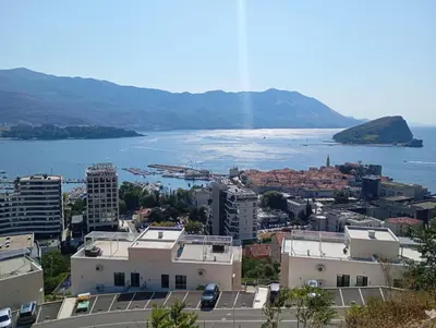 a view of a city and a body of water at Walk to the Sea-1 bedroom BUDVA in Budva
