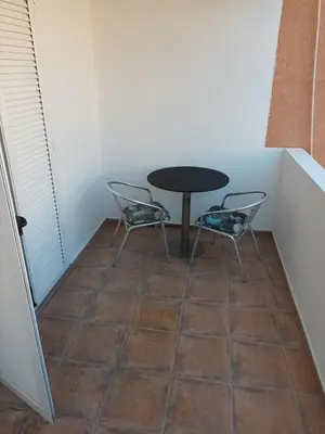 a table and two chairs in a small room at Walk to the Sea-1 bedroom BUDVA in Budva
