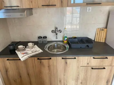 a kitchen counter top with a sink and a sink at Walk to the Sea-1 bedroom BUDVA in Budva