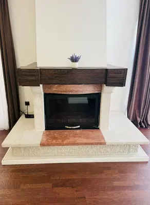 a living room with a fireplace with a tv at Sunny Bay Apartments in Budva