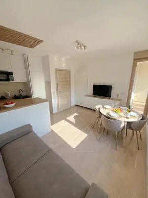 a living room with a couch and a table at Montehome sea view in Becici