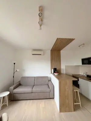 a living room with a couch and a kitchen at Montehome sea view in Becici
