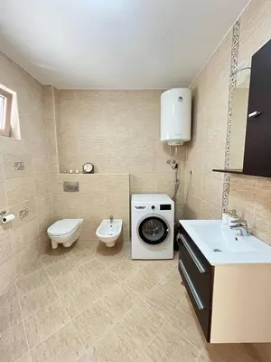 a bathroom with a washing machine and a sink at Montehome sea view in Becici