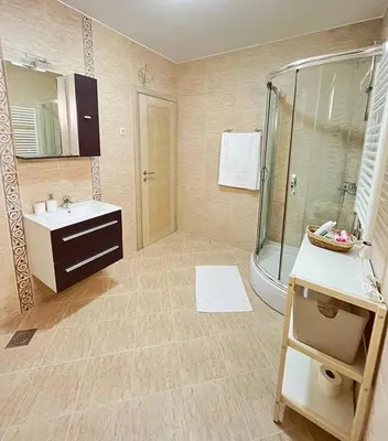 a bathroom with a shower and a sink at Montehome sea view in Becici