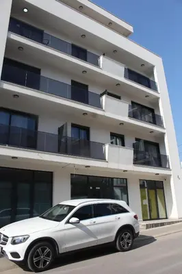 a white car parked in front of a building at AMD - stan 314 in Dobra Voda