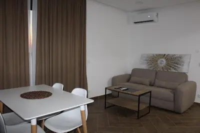 a living room with a couch and a table at AMD - stan 314 in Dobra Voda