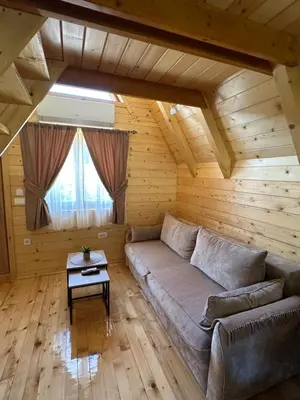 a living room with a couch and a table at Valley Nest in Virpazar