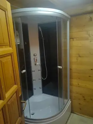 a shower with a glass door in a bathroom at River Escape Ada Bojana in Ulcinj