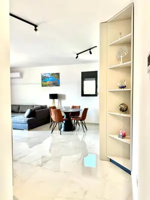 a living room with a couch and a table at Apartment BAR M3A sea view in Bar