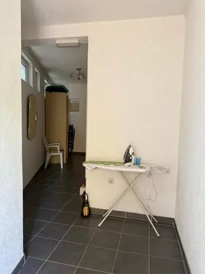 a room with a table and a tiled floor at Antoni Apartments in Ulcinj