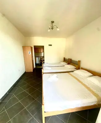 a room with three beds in a room at Antoni Apartments in Ulcinj