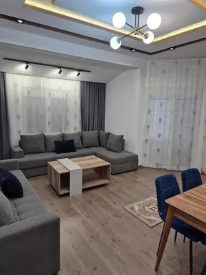 a living room with a couch and a table at Ajum Apartments in Ulcinj