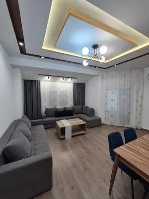 a living room with a couch and a table at Ajum Apartments in Ulcinj