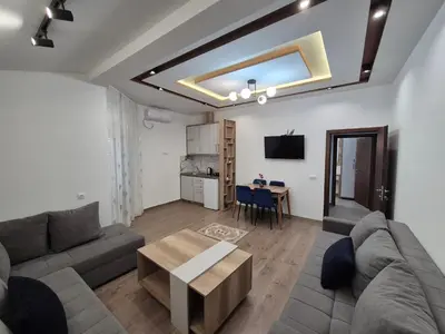 a living room with a couch and a table at Ajum Apartments in Ulcinj