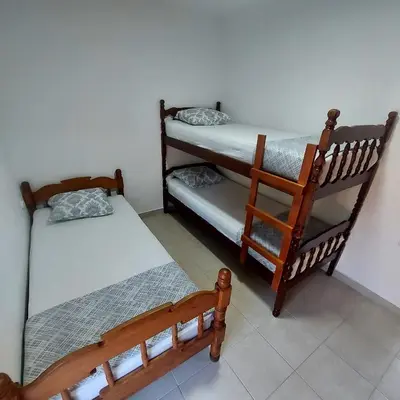 a room with two bunk beds and a chair at House in Nature Milić in Čanj