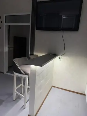 a table and a chair in a room at Petar Marstijepović in Bar, Susanj