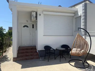 a porch of a house with chairs and a table at Petar Marstijepović in Bar, Susanj