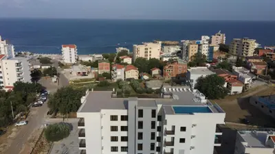 an aerial view of a city with buildings and the ocean at Premium 2 Dobra Voda in Dobra Voda