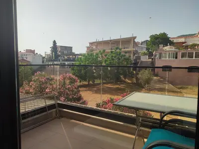 a balcony with a view of a city at Premium 2 Dobra Voda in Dobra Voda