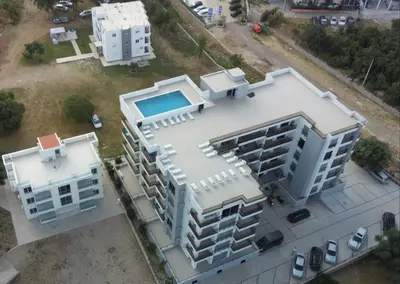 an overhead view of a building with a swimming pool at Premium 2 Dobra Voda in Dobra Voda