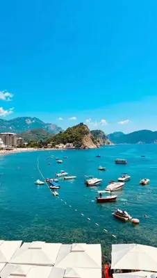 a group of boats in a large body of water at Apartments First Line in Petrovac na Moru