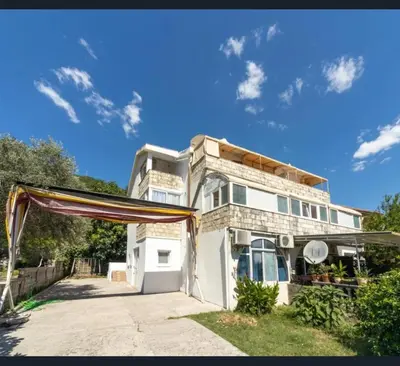 a house with a canopy in front of it at Lalic House Budva in Budva