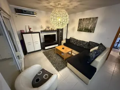 an aerial view of a living room with a couch at two bedroom apartment with parking in Petrovac na Moru