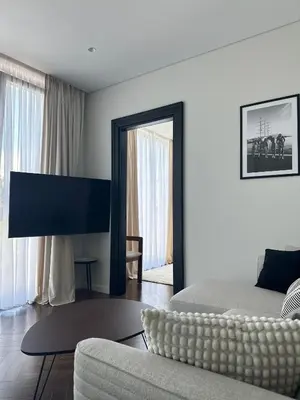 a living room with a couch and a mirror at Nika in Tivat