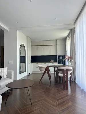 a kitchen and living room with a table and chairs at Nika in Tivat