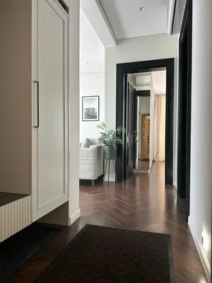 a hallway with a living room with a couch at Nika in Tivat