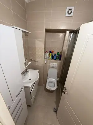 a small bathroom with a toilet and a sink at Stan na dan BUDVA in Budva