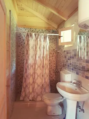 a bathroom with a toilet and a sink at Sweet one bedroom cottage Ada Bojana - Ulcinj in Ulcinj