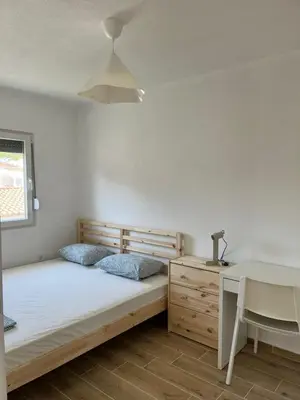 a bedroom with a bed and a desk and a desk at Deskos sea house in Sutomore I floor in Sutomore