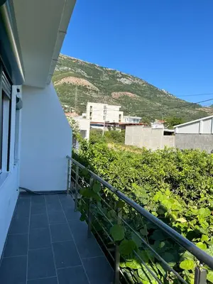 a balcony of a house with a hill in the background at Deskos sea house in Sutomore I floor in Sutomore