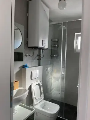 a bathroom with a toilet and a sink and a shower at Deskos sea house in Sutomore I floor in Sutomore