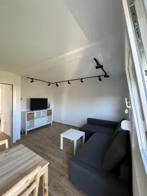 a living room with a couch and a table at Deskos sea house in Sutomore I floor in Sutomore