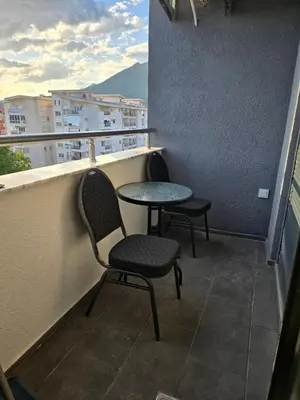two chairs and a table on a balcony at Lux Apartment Dani in Bar