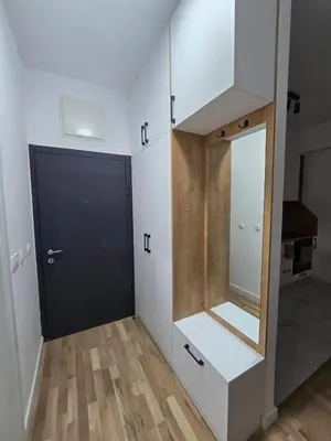 a room with a black door and a mirror at Lux Apartment Dani in Bar