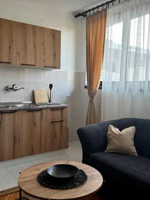 a living room with a couch and a table at Apartman M5 in Cetinje