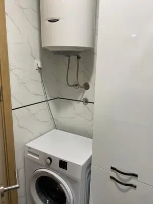 a washer and dryer in a small bathroom at Nata 25 in Becici