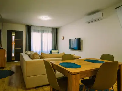 a living room with a couch and a table at TaNa's Villa in Donji Štoj