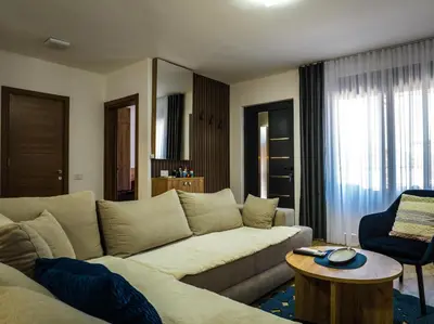 a living room with a couch and a table at TaNa's Villa in Donji Štoj